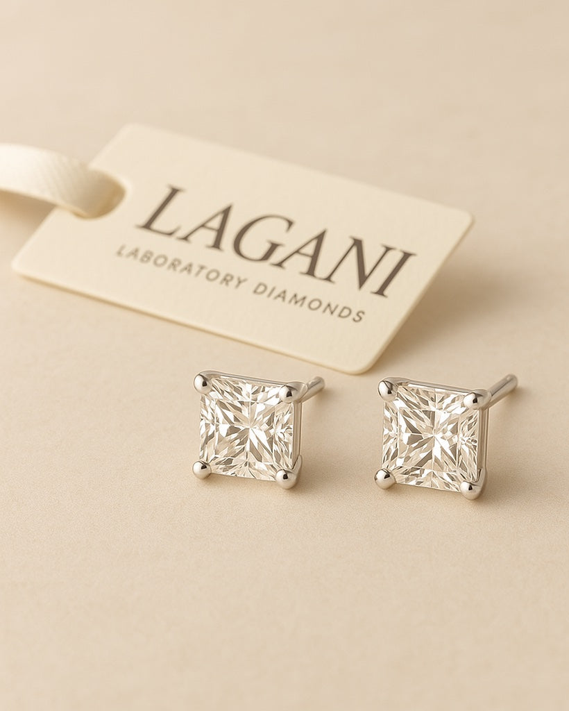 Close up shot of 1.06 ct princess cut diamond earrings.
