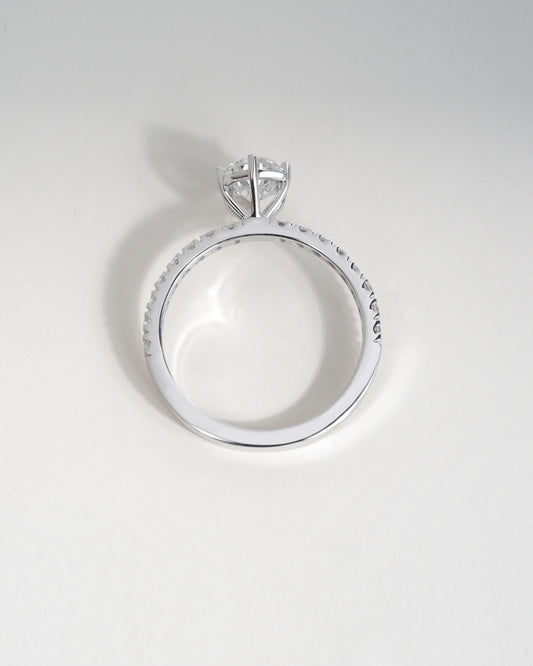 Close up shot of pear cut lab grown diamond engagement ring in white gold.