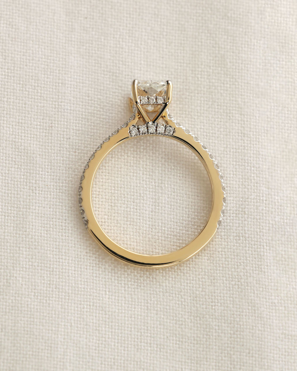 Diamond ring on a light beige background