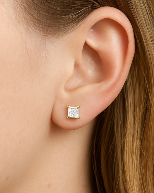 Person wearing 1.06 ct princess cut diamond earrings.
