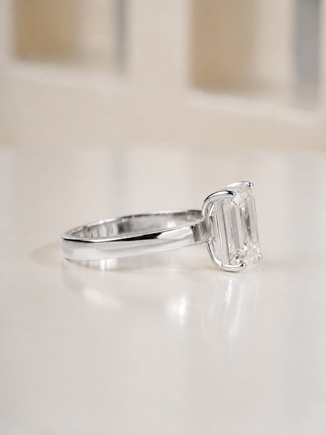 2.00ct emerald cut lab grown diamond solitaire engagement ring in white gold, angled view