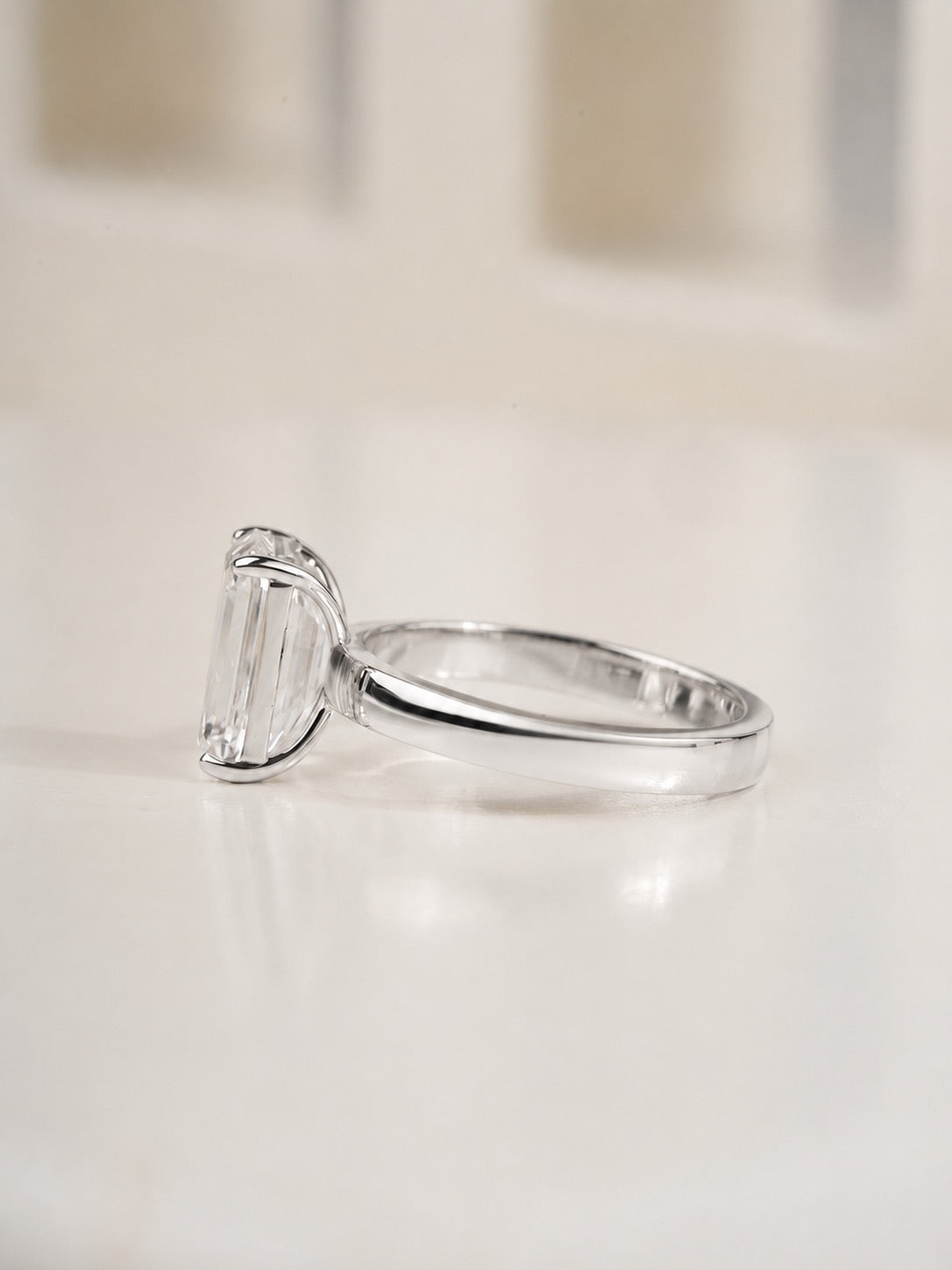 2.00ct emerald cut lab grown diamond solitaire engagement ring, styled shot