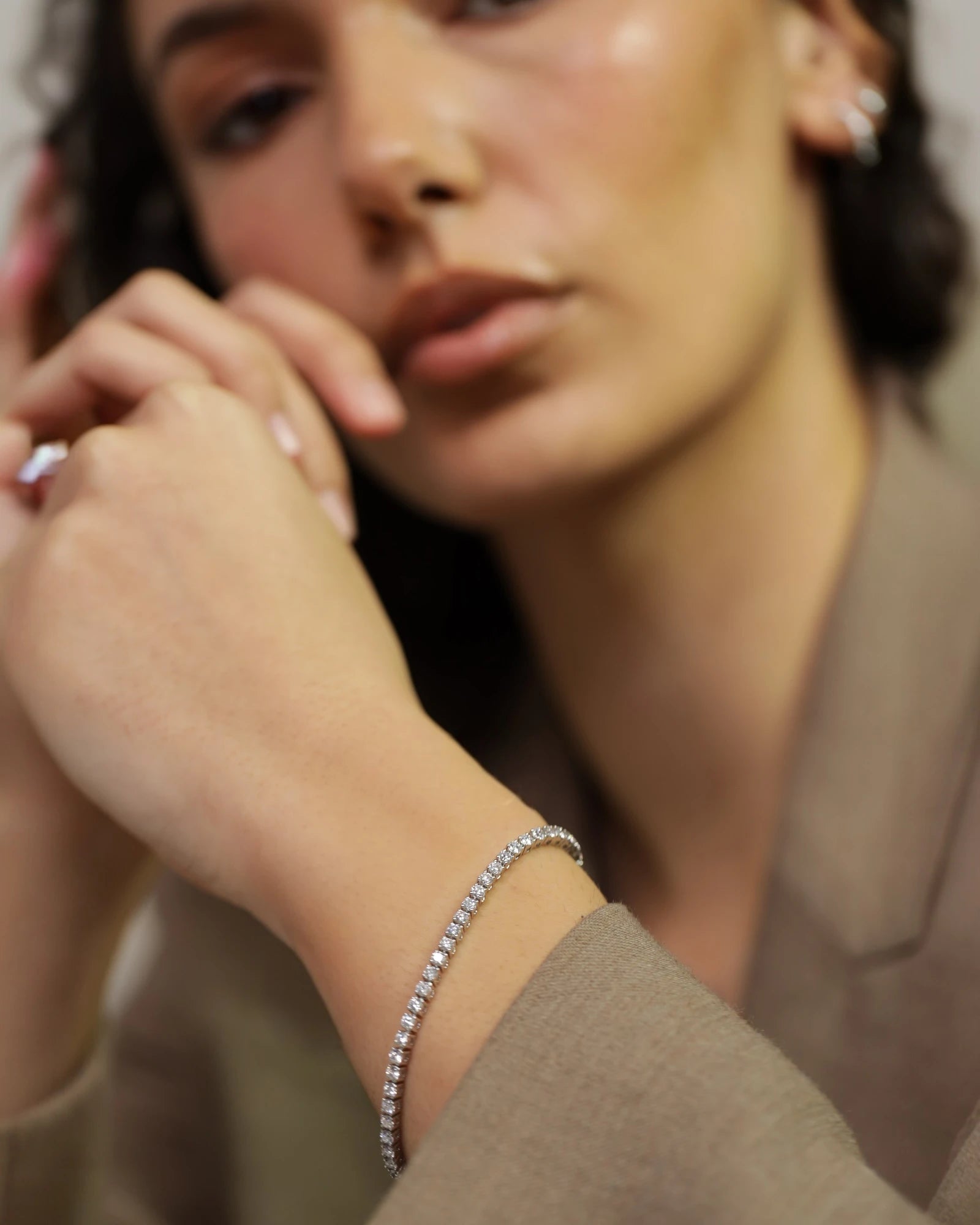 Diamond bracelet on a wrist.