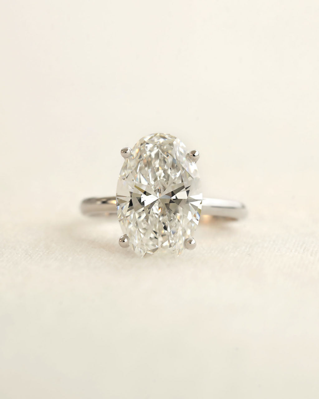 Diamond ring on a light beige background