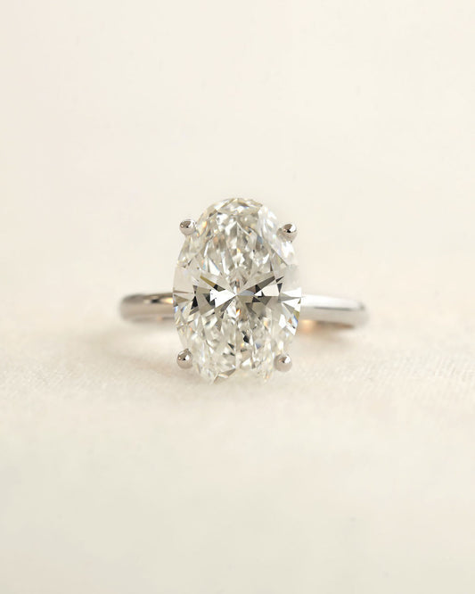 Diamond ring on a light beige background