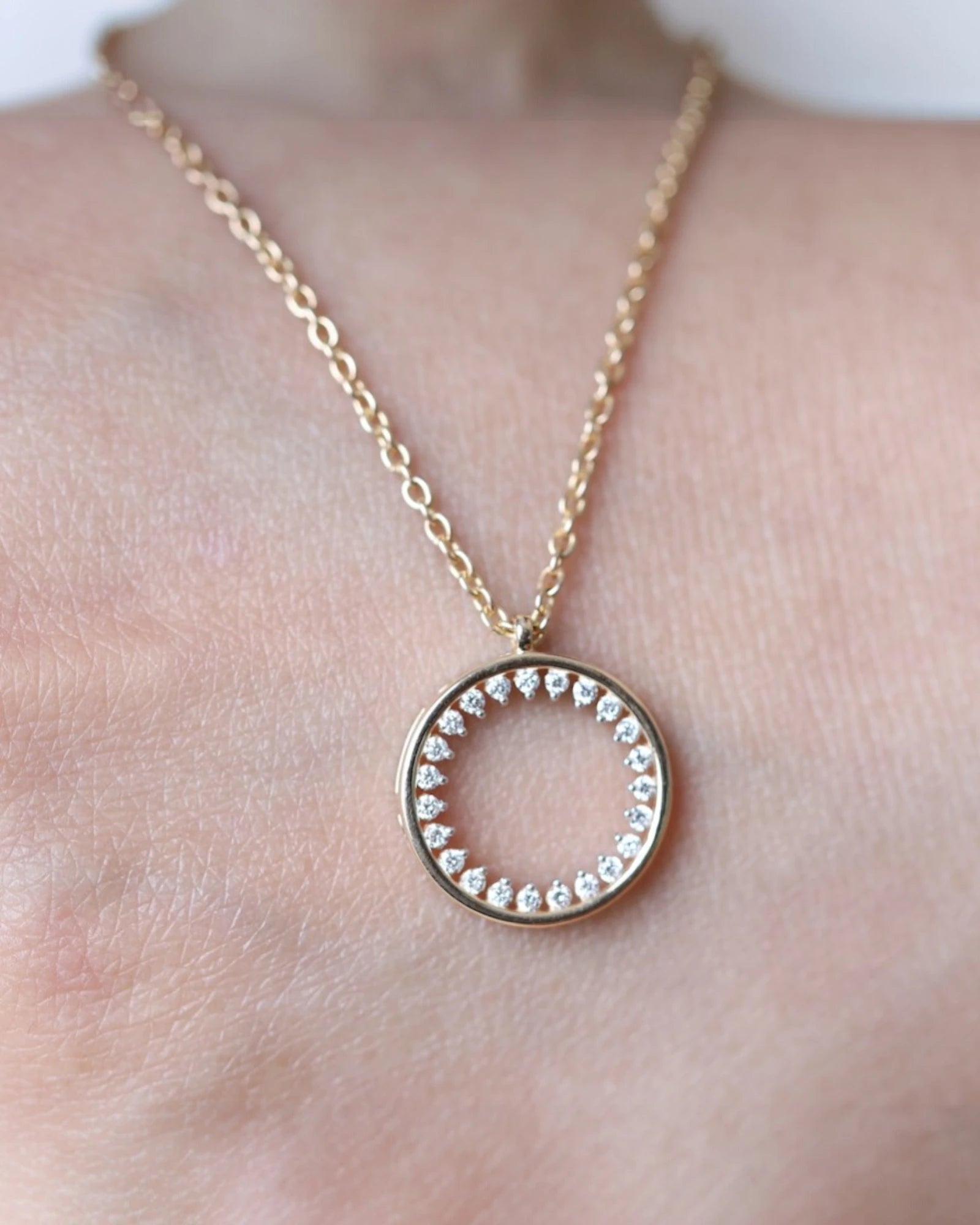 Close up of circle lab grown diamond pendant necklace.