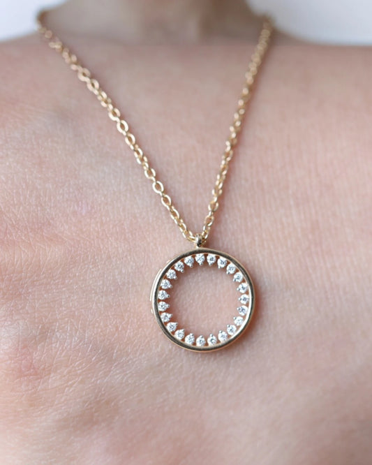 Close up of circle lab grown diamond pendant necklace.