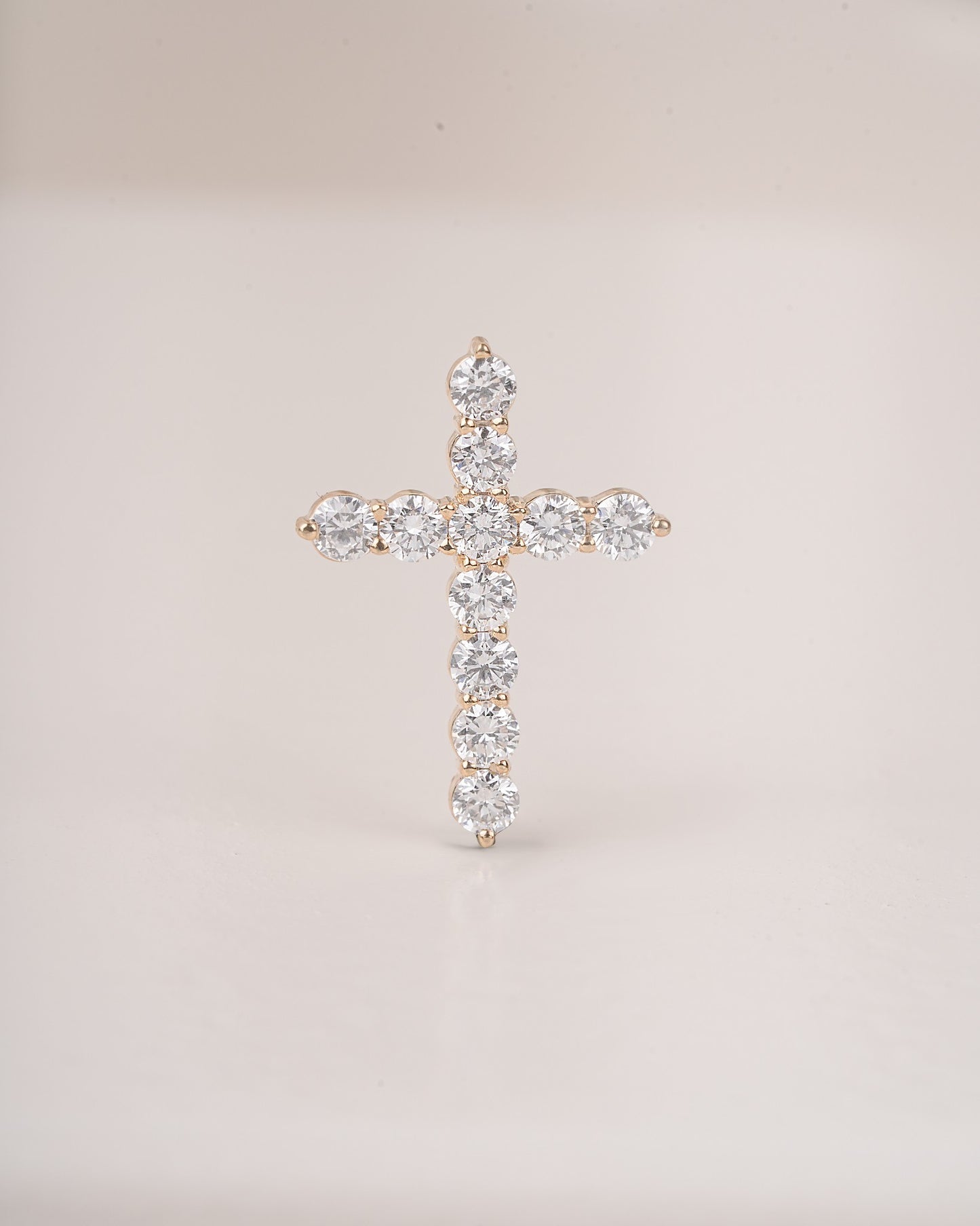 Close up shot of cross diamond pendant.