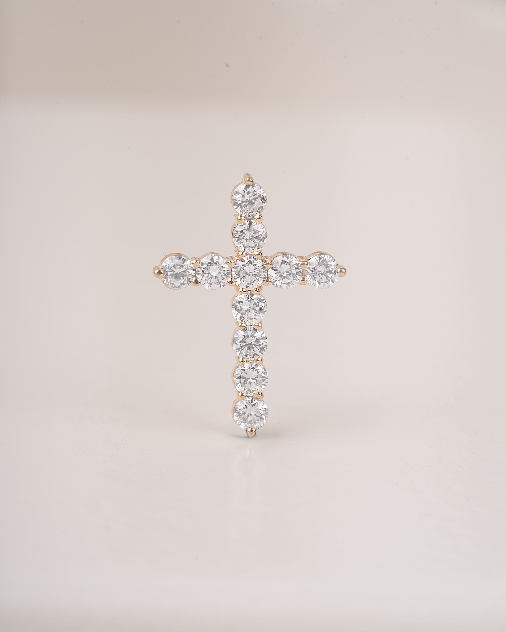 Close up shot of cross diamond pendant.