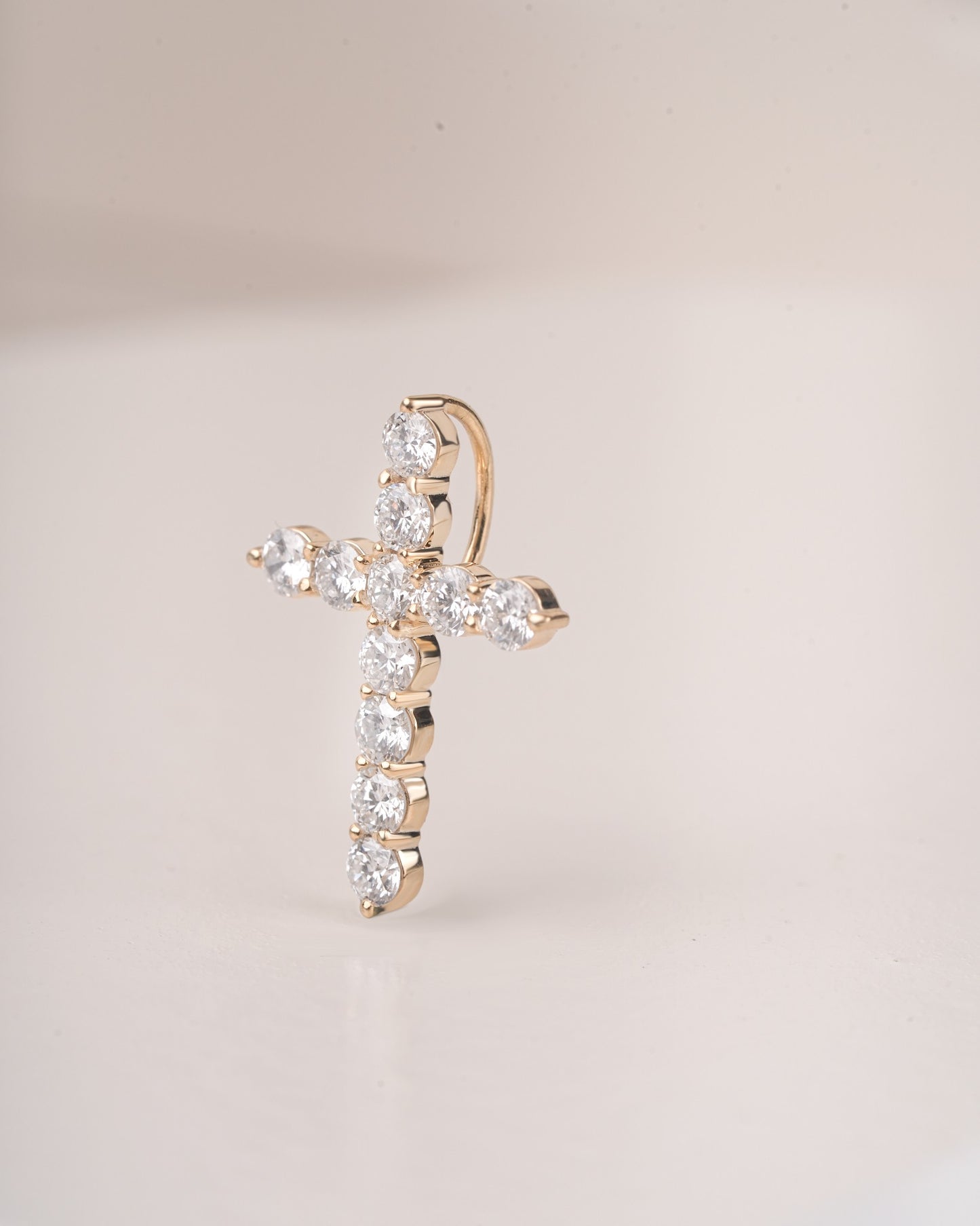 Close up shot of cross diamond pendant.