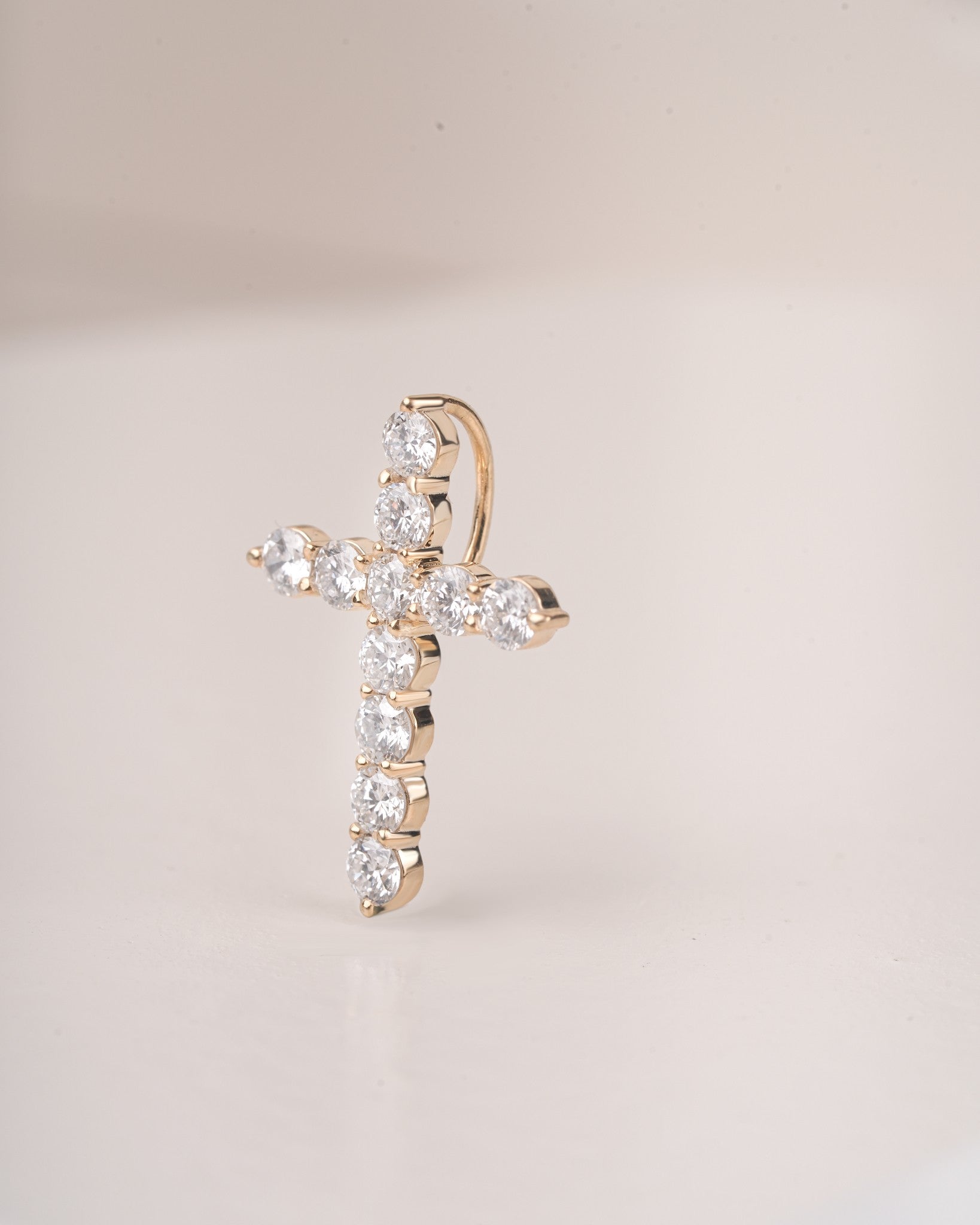 Close up shot of cross diamond pendant.