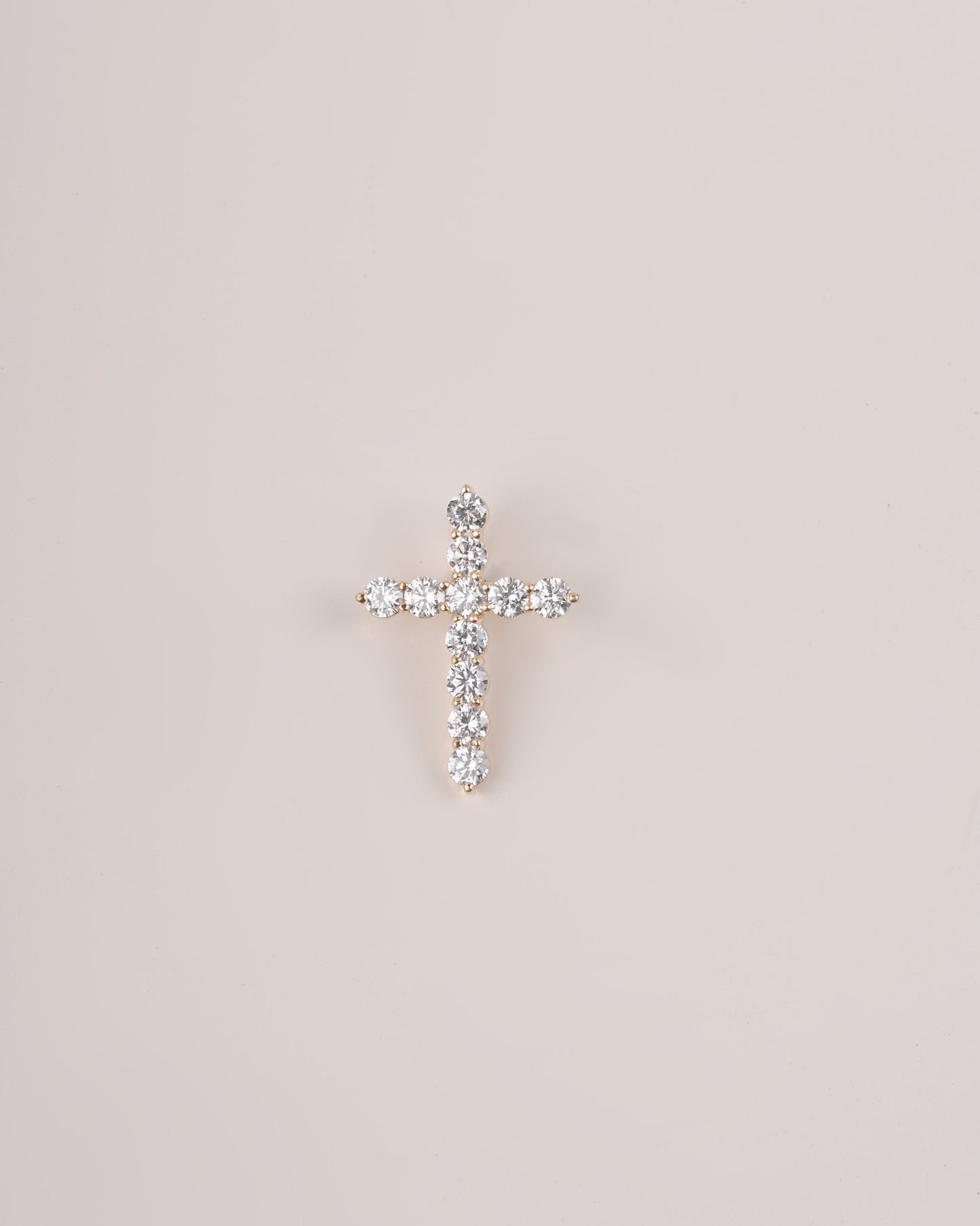 Close up shot of cross diamond pendant.