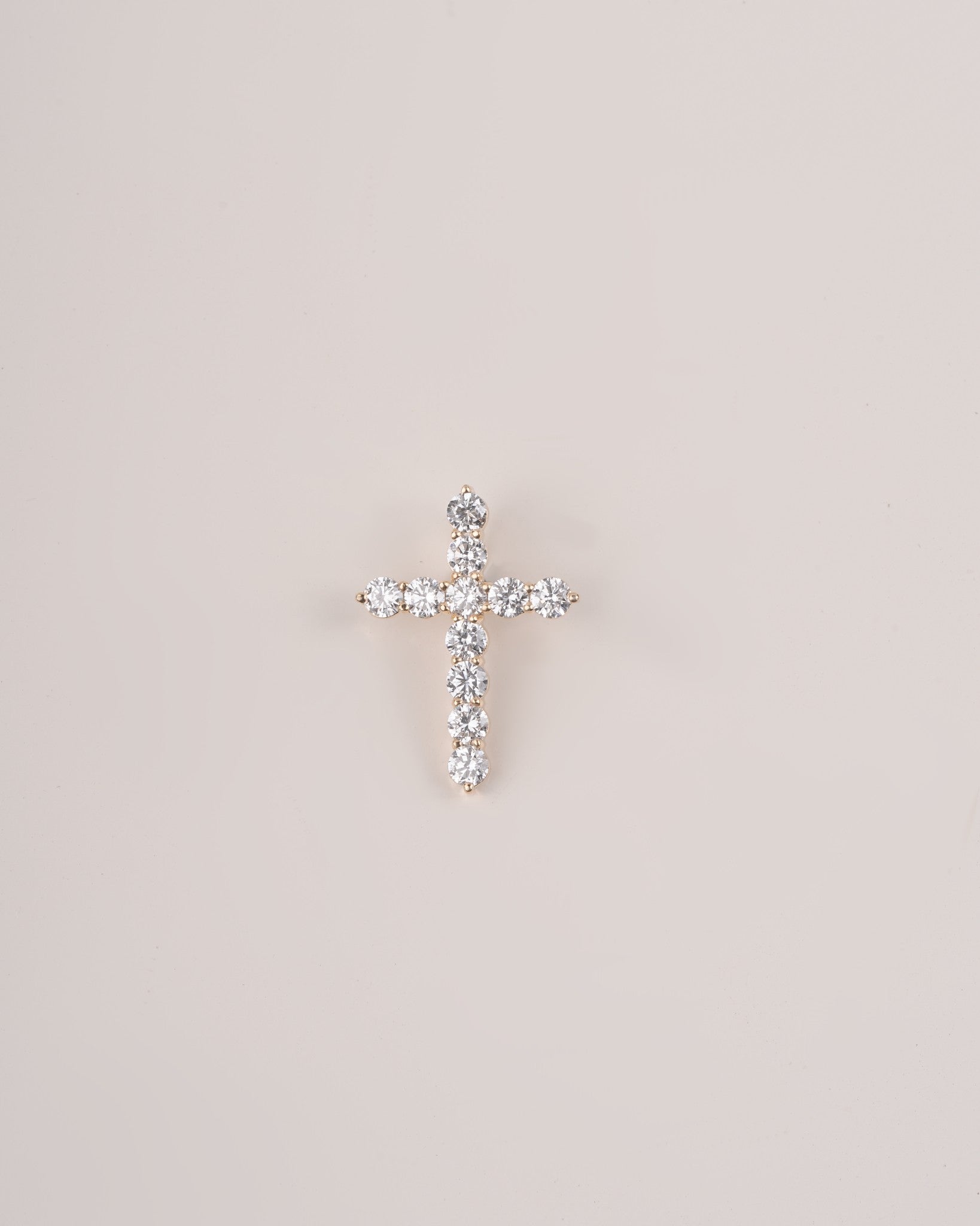 Close up shot of cross diamond pendant.