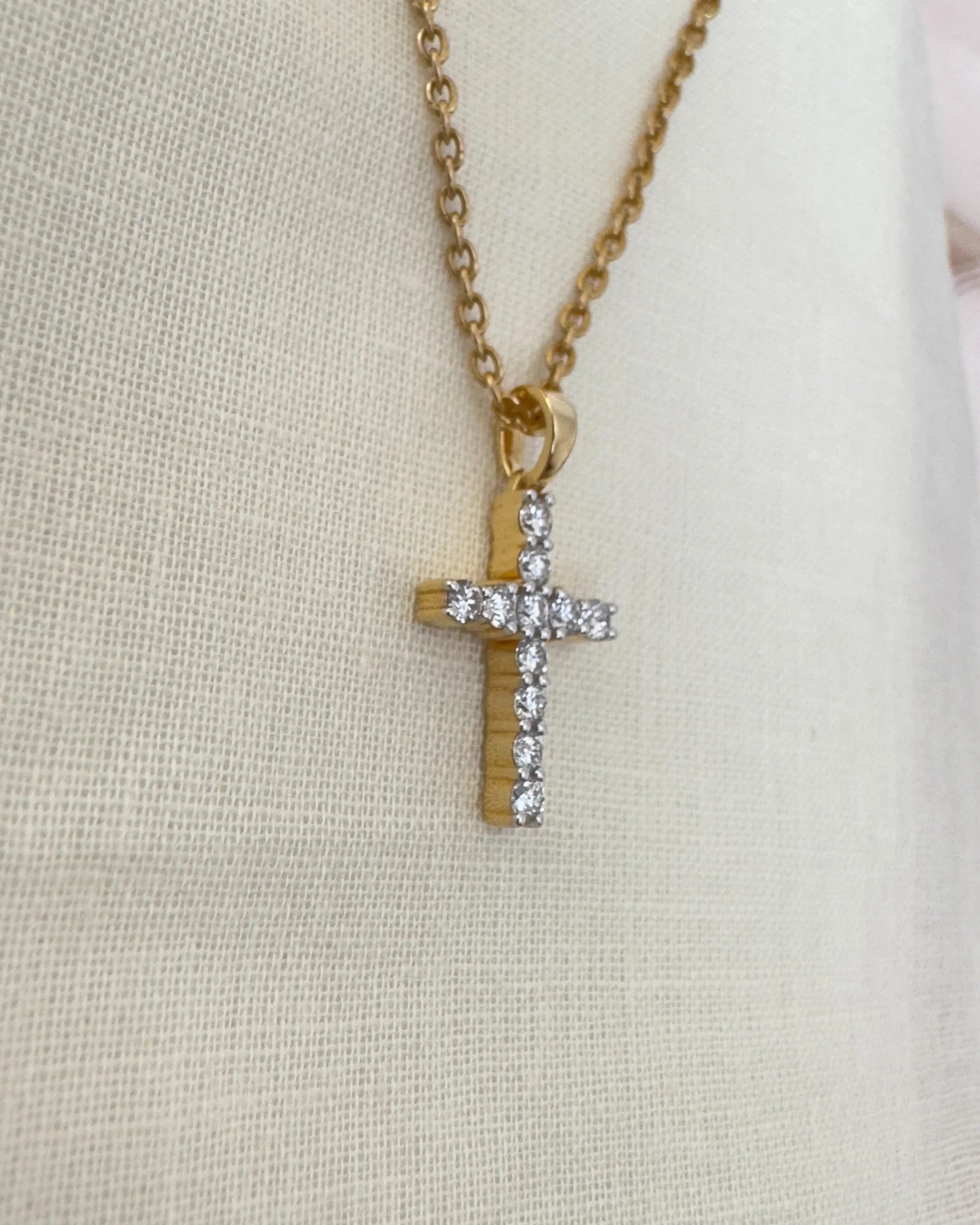 Close up shot of diamond cross pendant.