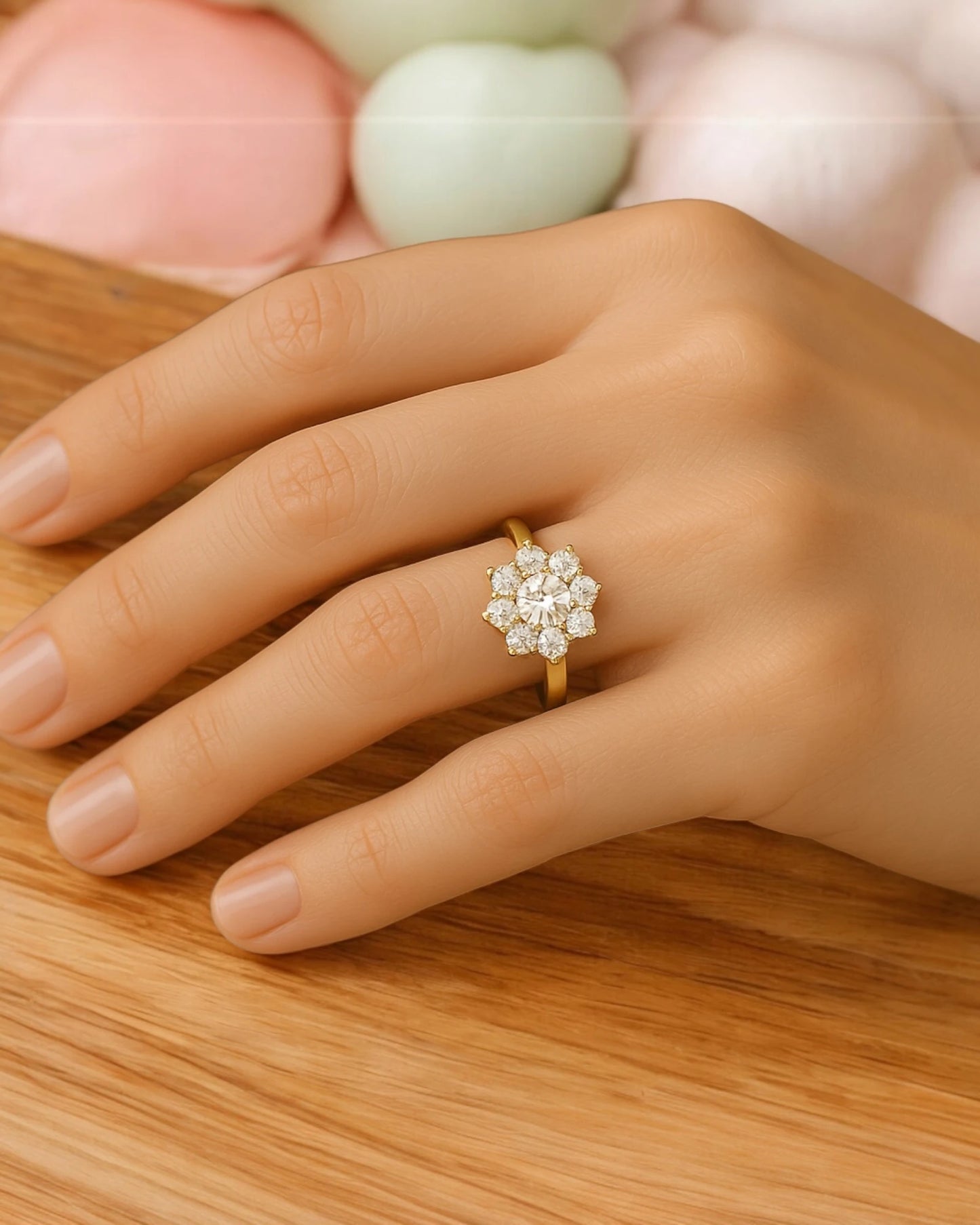 Hand wearing floral halo diamond cluster ring.