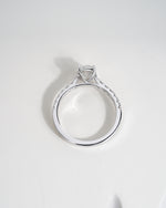 Close up shot of oval cut lab grown diamond engagement ring in white gold.
