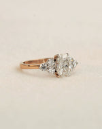 Side view of oval cut diamond engagement ring in rose gold.
