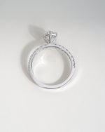 Close up shot of pear cut lab grown diamond engagement ring in white gold.
