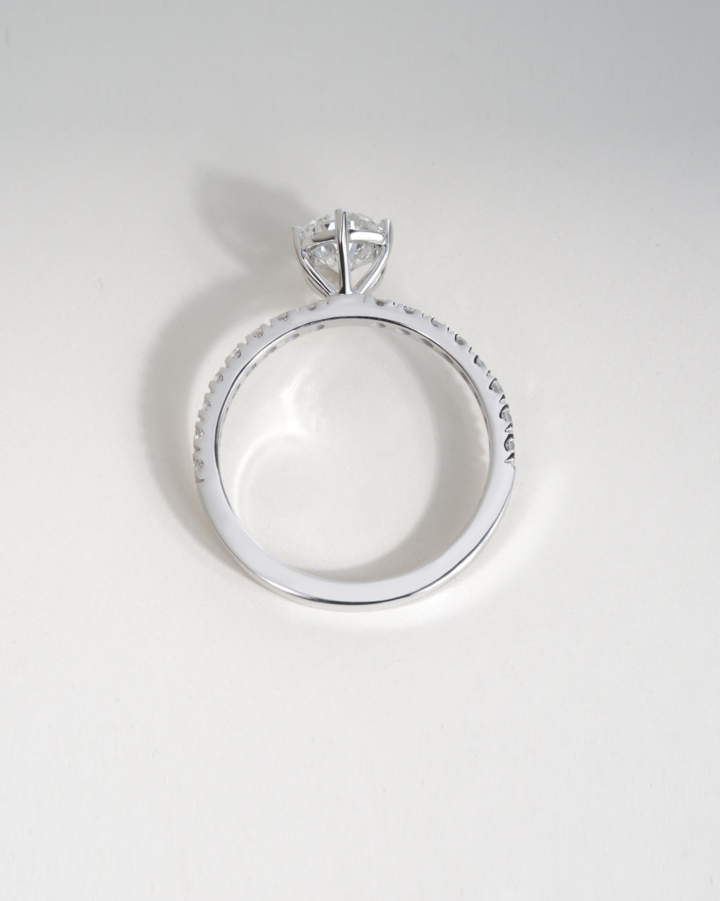 Close up shot of pear cut lab grown diamond engagement ring in white gold.
