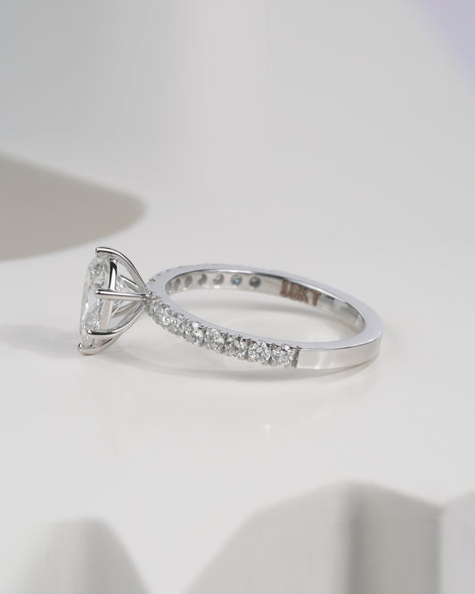 Side view of pear cut lab grown diamond engagement ring in white gold.