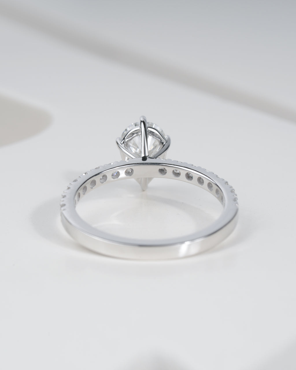 Close up shot of pear cut lab grown diamond engagement ring in white gold.