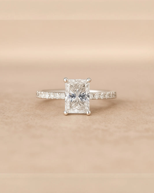 Close up of radiant cut diamond ring.