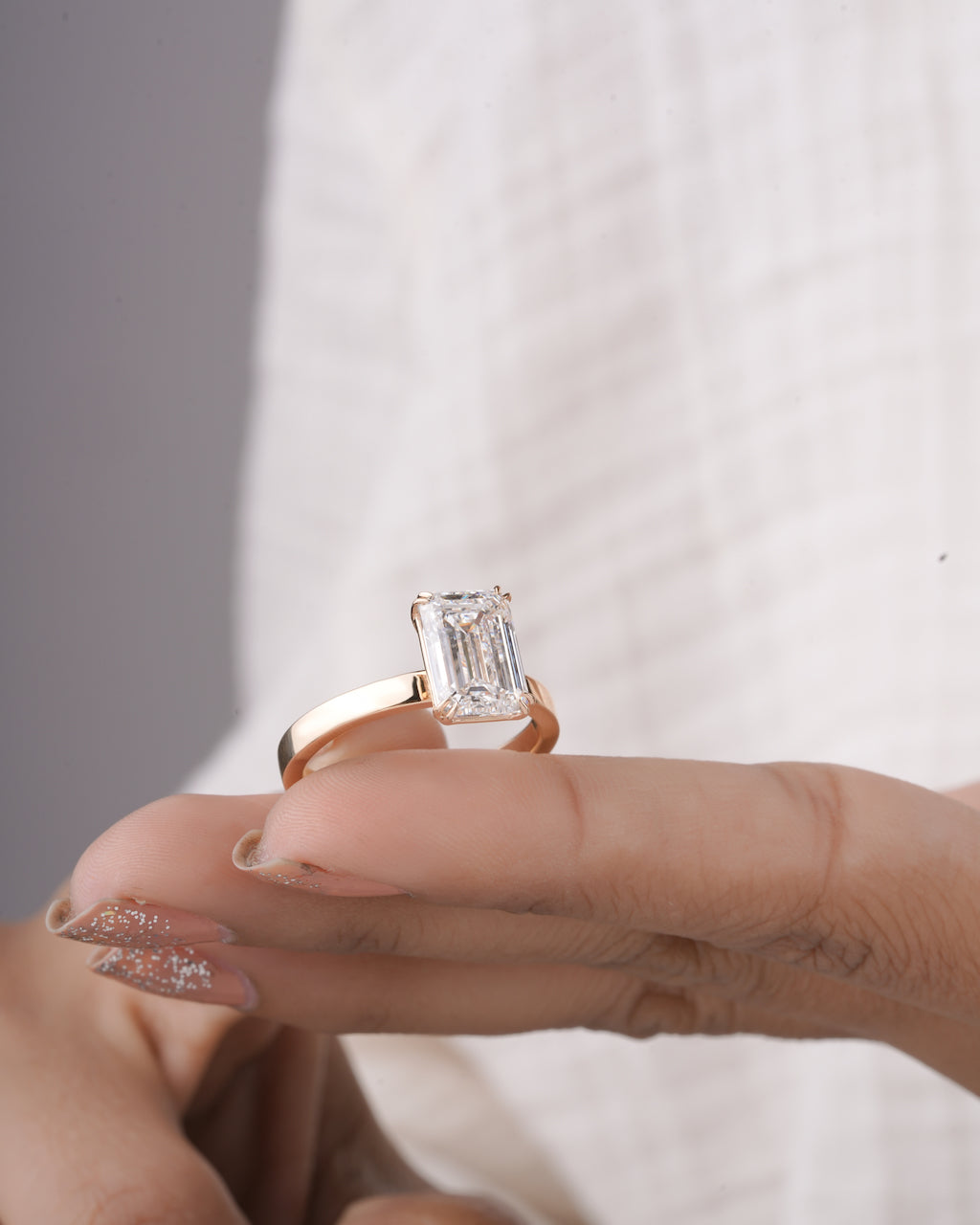 4 ct emerald cut lab grown diamond engagement ring angled view LAGANI