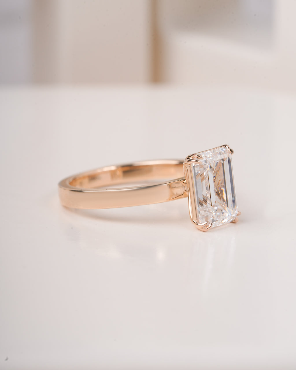 4 ct emerald cut lab grown diamond engagement ring styled shot LAGANI