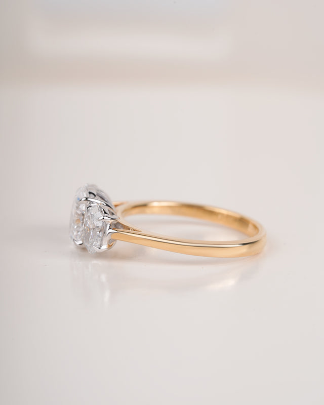 Close up shot of three stone diamond ring.